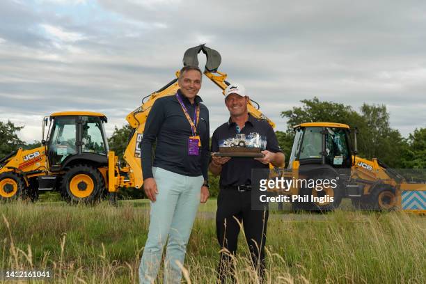 Keith Mitchell, Marketing Director of Legends Tour poses with Alex Cejka of Germany during Day Three of The JCB Championship at JCB Golf & Country...