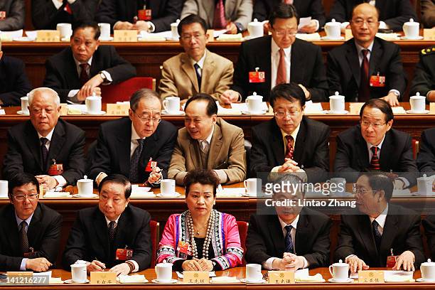 Delegates take their seats for the closing session of the National Committee of the Chinese People's Political Consultative Conference at the Great...