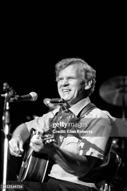 Doc Watson performing at the Nitty Gritty Dirt Band's 20th Anniversary Concert at the McNichols Sports Arena in Denver, Colorado on June 10, 1986.