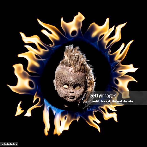 head of a doll broken and destroyed by flames. - forsaken film stock pictures, royalty-free photos & images