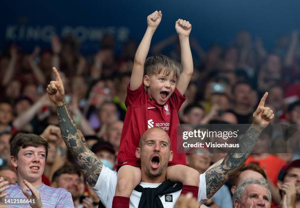 Young Liverpool fan on the shoulders of his father aduring The FA Community Shield between Manchester City and Liverpool FC at The King Power Stadium...