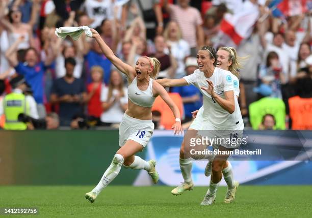 Chloe Kelly of England celebrates with team mates after scoring their side's second goal in extra time during the UEFA Women's Euro 2022 final match...