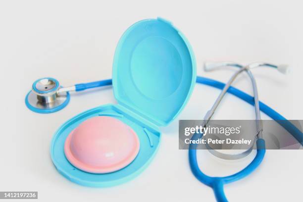 diaphragm on white background - female condoms stock pictures, royalty-free photos & images