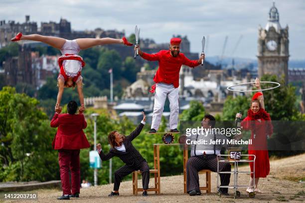 Circus company Lost in Translation show off some tricks at the top of Calton Hill on August 01, 2022 in Edinburgh, Scotland. The Guinness World...