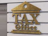 Tax Office Sign on Concrete Wall