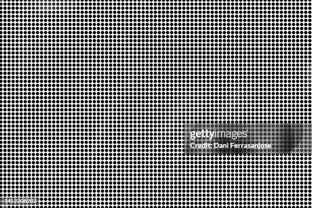 hypnotic image of black dots on white background. - à pois photos et images de collection