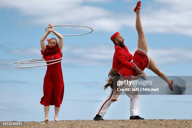 Circus company Lost in Translation show off some tricks at the top of Calton Hill on August 01, 2022 in Edinburgh, Scotland. The Guinness World...