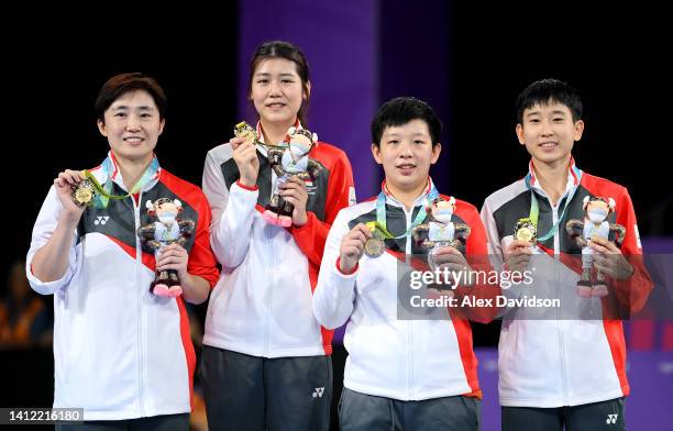 Gold Medallists Team Singapore celebrate during the Women's Team medal ceremony on day four of the Birmingham 2022 Commonwealth Games at NEC Arena on...