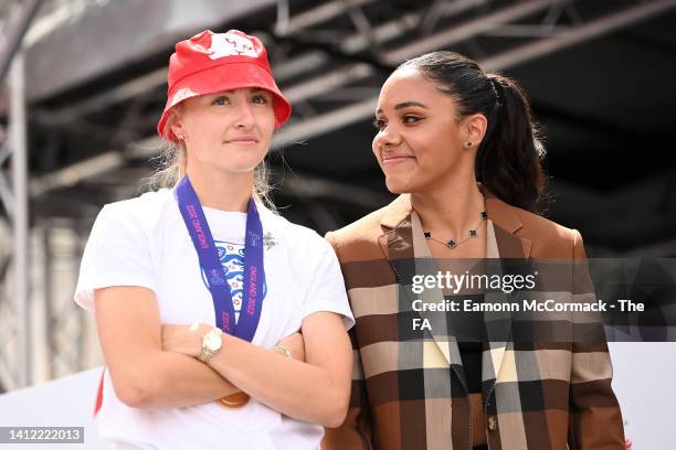 Alex Scott , Former Footballer and Presenter stands with Leah Williamson of England during the England Women's Team Celebration at Trafalgar Square...
