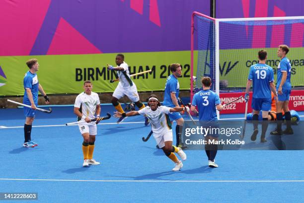 Mustapha Cassiem of Team South Africa celebrates after scoring their sides third goal during Men's Hockey - Pool A match between Scotland and South...