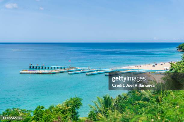 aerial views of crash boat beach located in puerto rico. - aguadilla puerto rico fotografías e imágenes de stock