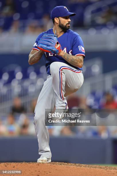 Matt Bush of the Texas Rangers delivers a pitch during the eighth inning against the Miami Marlins at loanDepot park on July 21, 2022 in Miami,...