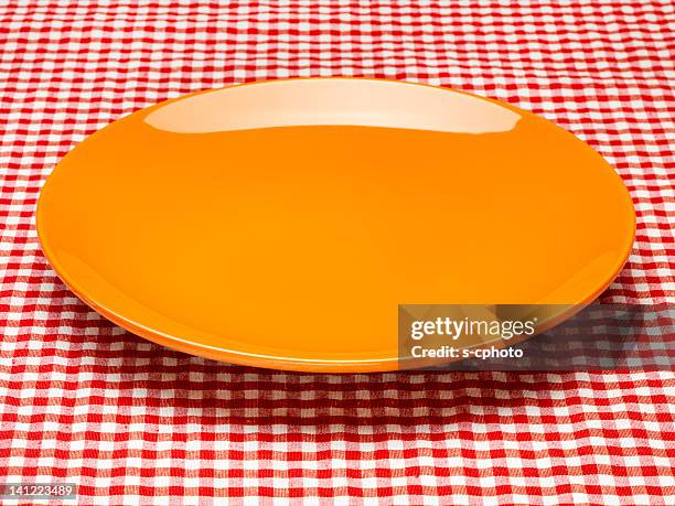 https://media.gettyimages.com/id/141223489/photo/orange-plate-on-the-checkered-tablecloth.jpg?s=612x612&w=gi&k=20&c=MYLIWUOW9RCuZg5b59xgD8lxXLZ_fivKgYIA7uAIDKI=