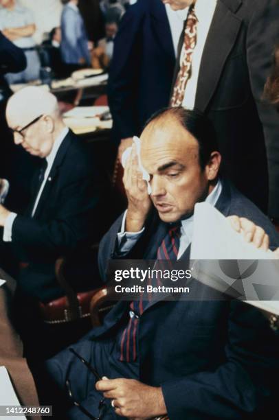 Former presidential aide John Ehrlichman wipes his forehead during his third day of testimony before the Senate Watergate Committee.