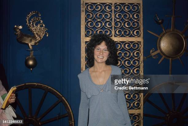 Linda Lovelace , the star of the X-rated movie Deep Throat, is shown answering questions in her New York City hotel room.