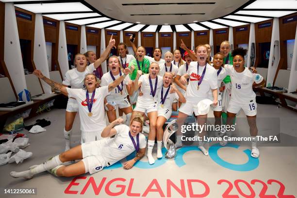 The England Team celebrate in the dressing room with the UEFA Women's EURO 2022 Trophy following victory in the UEFA Women's Euro 2022 final match...