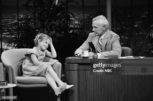Air Date -- Pictured: Actress Drew Barrymore, host Johnny Carson -- Photo by: Gene Arias/NBCU Photo Bank