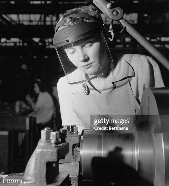 Woman Operating a Lathe Woman Operating a Lathe
