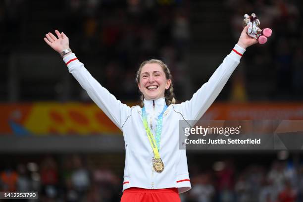 Gold Medalist, Laura Kenny of Team England celebrates on the podium during the Women's 10km Scratch Race medal ceremony on day four of the Birmingham...