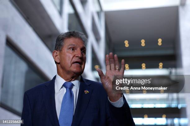 Sen. Joe Manchin gestures as he speaks to reporters in the Hart Senate Office building on August 01, 2022 in Washington, DC. Manchin, who returned to...