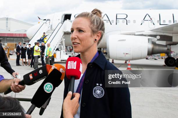 Svenja Huth of Germany speaks to the media during the arrival of the Germany Women's National Soccer Team from the UEFA Women's EURO 2022 at...