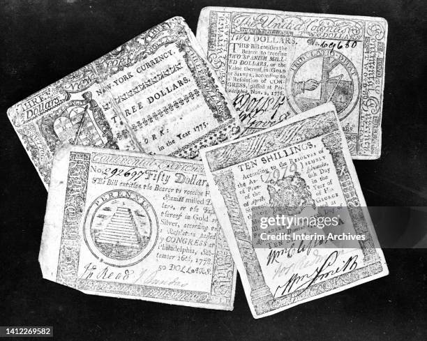 Examples of currency printed by American colonies, including New York dollars, Pennsylvania shillings, and Continental dollars, late eighteenth...
