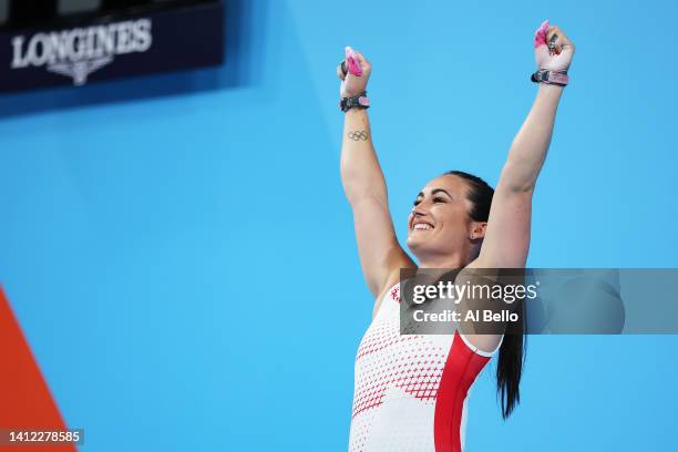 Sarah Davies of Team England reacts after performing a snatch during Women's 71kg - Final on day four of the Birmingham 2022 Commonwealth Games at...