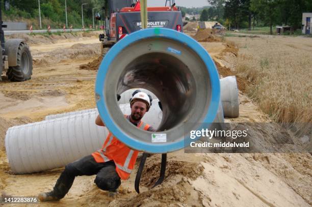 construction a new main sewage system - linear drainage stock pictures, royalty-free photos & images