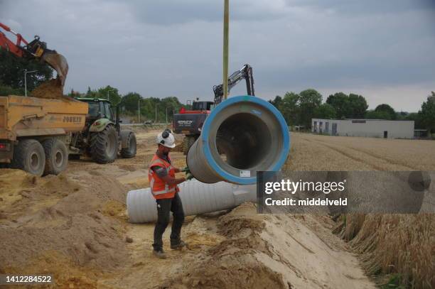 construction a  new main sewage system - sewage pipe stock pictures, royalty-free photos & images