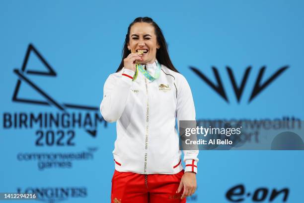 Gold medalist Sarah Davies of Team England poses on the podium during Women's 71kg - Final medal ceremony day four of the Birmingham 2022...