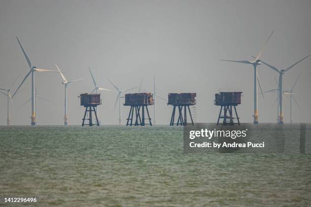 thanet wind farm and the maunsell forts, kent, united kingdom - kent coastline stock pictures, royalty-free photos & images