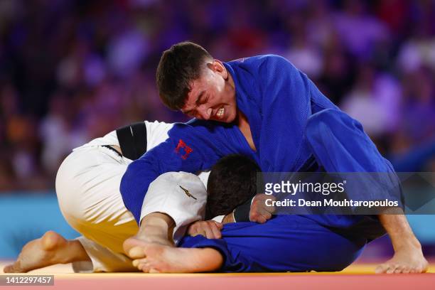 Finlay Allan of Team Scotland and Georgios Balarjishvili compete during the Men's - 66 kg - Final on day four of the Birmingham 2022 Commonwealth...