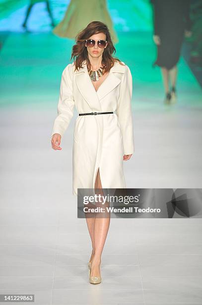 Model showcases a design by Wayne Cooper during the L'Oreal Paris runway 5 on day six of the 2012 L'Oreal Melbourne Fashion Festival on March 13,...