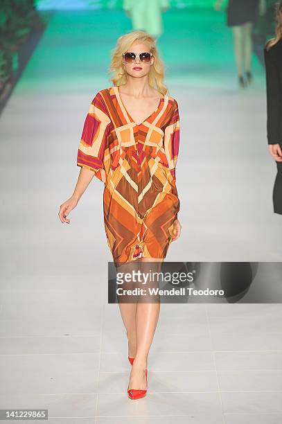Model showcases a design by Wayne Cooper during the L'Oreal Paris runway 5 on day six of the 2012 L'Oreal Melbourne Fashion Festival on March 13,...