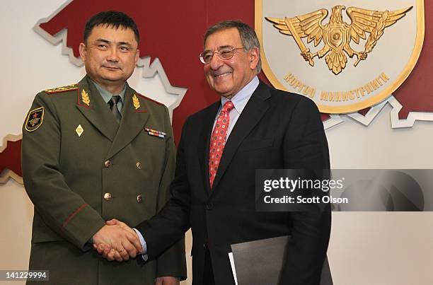 Secretary of Defense Leon Panetta poses for a picture with Kyrgyzstan’s Minister of Defense Taalaybek Omuraliev on March 13, 2012 in Bishkek,...