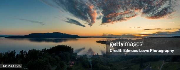 sunset aerial view of legoe bay on lummi island, washington. - argentinien island stock pictures, royalty-free photos & images