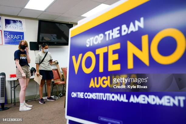 Canvasser for the Vote No on the Constitutional Amendment on Abortion is given their route by organizer Jae Gray at the Johnson County Democratic...