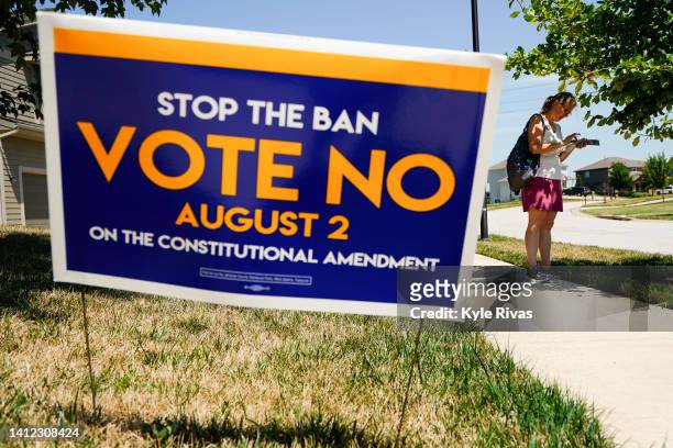 Erin Woods for the Vote No on the Constitutional Amendment on Abortion canvases a neighborhood on August 01, 2022 in Lenexa, Kansas. On August 2,...