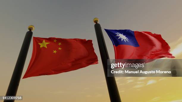 flags of the people's republic of china and of taiwan (republic of china) - dispute stock-fotos und bilder