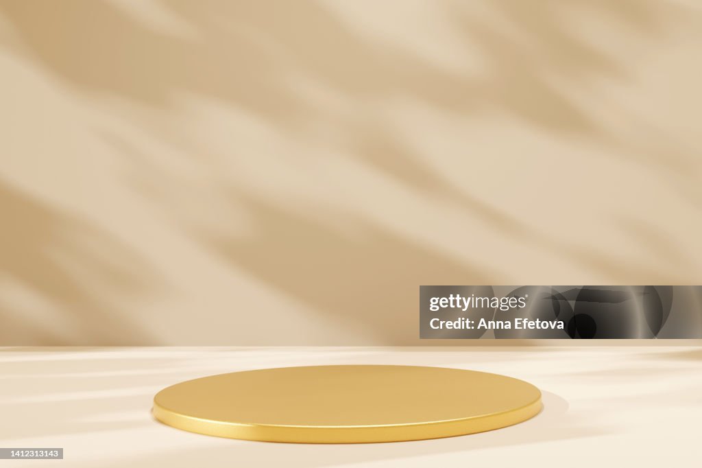 Golden podium on beige background with natural shadows. Perfect platform for your product. Three dimensional illustration