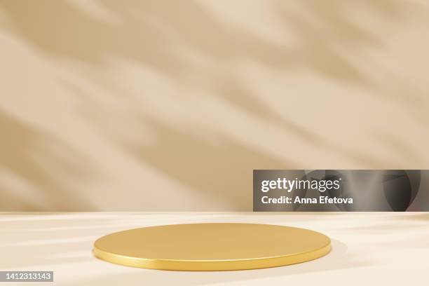 golden podium on beige background with natural shadows. perfect platform for your product. three dimensional illustration - beige background bildbanksfoton och bilder