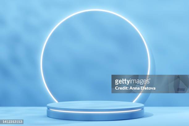two blue podiums on monochrome background with shadows. perfect platform for your product. three dimensional illustration - blue podium stock pictures, royalty-free photos & images