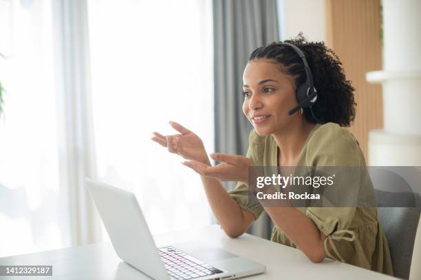 young call center agent working in an office - call center agents imagens e fotografias de stock