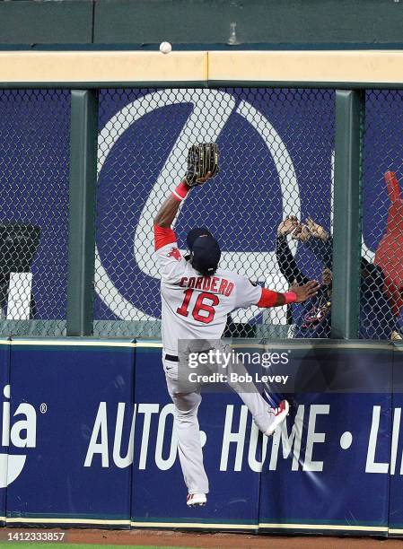 Franchy Cordero of the Boston Red Sox comes up short on a ball at the wall off the bat of Yuli Gurriel of the Houston Astros that went for a double...