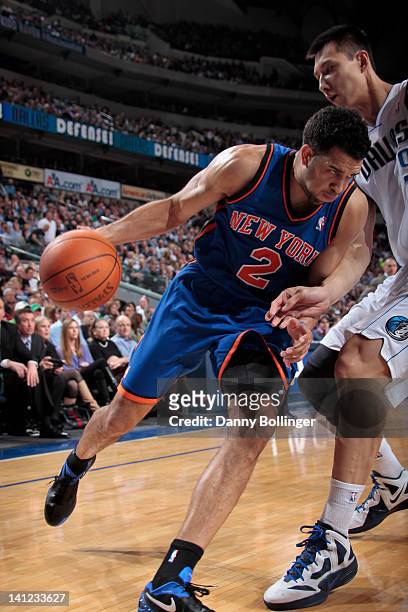 Landry Fields of the New York Knicks posts up against Yi Jianlian of the Dallas Mavericks on March 6, 2012 at the American Airlines Center in Dallas,...