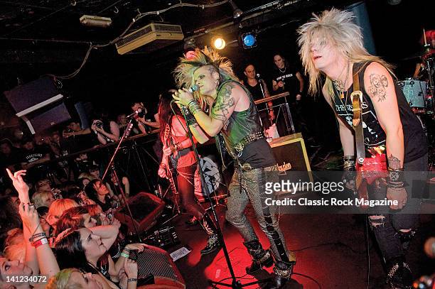 Martin Sweet, Simon Cruz and Peter London of Swedish glam metal group Crashdiet performing live on stage at the Camden Underworld in London, on...