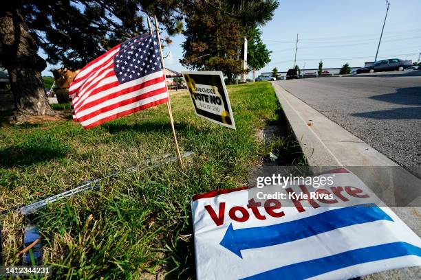 Olathe, KANSAS A vote here sign lays on the ground on August 01, 2022 in Olathe, Kansas. On August 2, voters will vote on whether or not to remove...