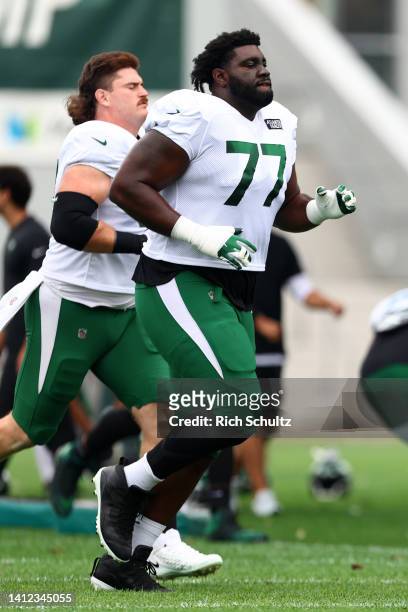 Tackle Mekhi Becton of the New York Jets during training camp at Atlantic Health Jets Training Center on August 1, 2022 in Florham Park, New Jersey.