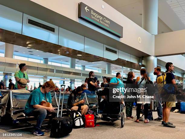 passengers wait to board a southwest airlines flight at denver international airport - denver summer stock pictures, royalty-free photos & images