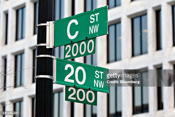 The William McChesney Martin Jr. Federal Reserve building, behind signs, sits at 20th And C Streets in Washington, D.C., U.S., on Tuesday, March 13,...